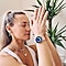 A closeup of Cat Meffan with her palms placed together with her eyes closed. She is wearing a pink Galaxy Watch Active2 with the Breathe feature on-display.