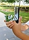 Hands holding a small mirror against a phantom black Galaxy S21 Ultra 5G just below the camera lens