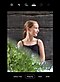 The screen of a Galaxy S21 Ultra 5G  showing a girl wearing a black shirt looking off to her side with green leaves reflected on the bottom half of the photo.