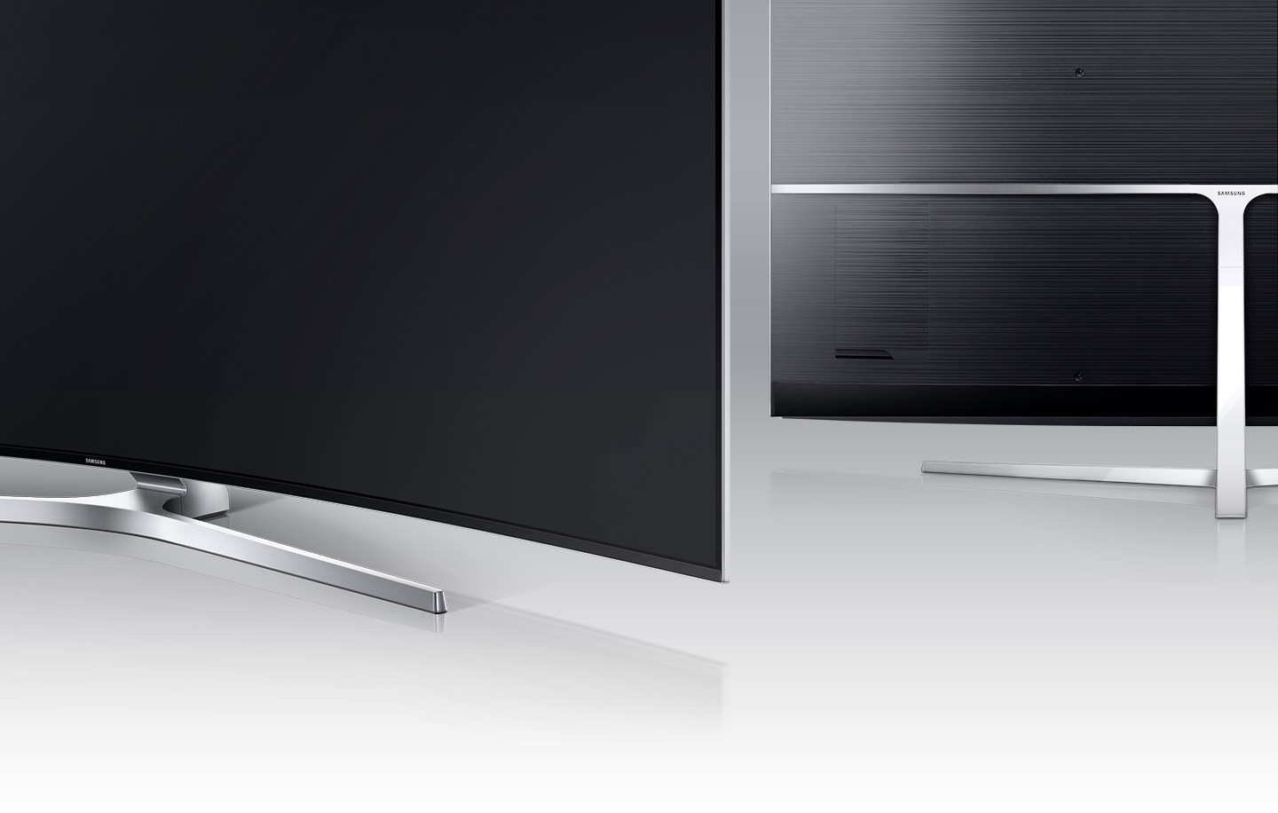 Pohled zezadu na stojan ve tvaru T k Samsung SUHD televizoru .