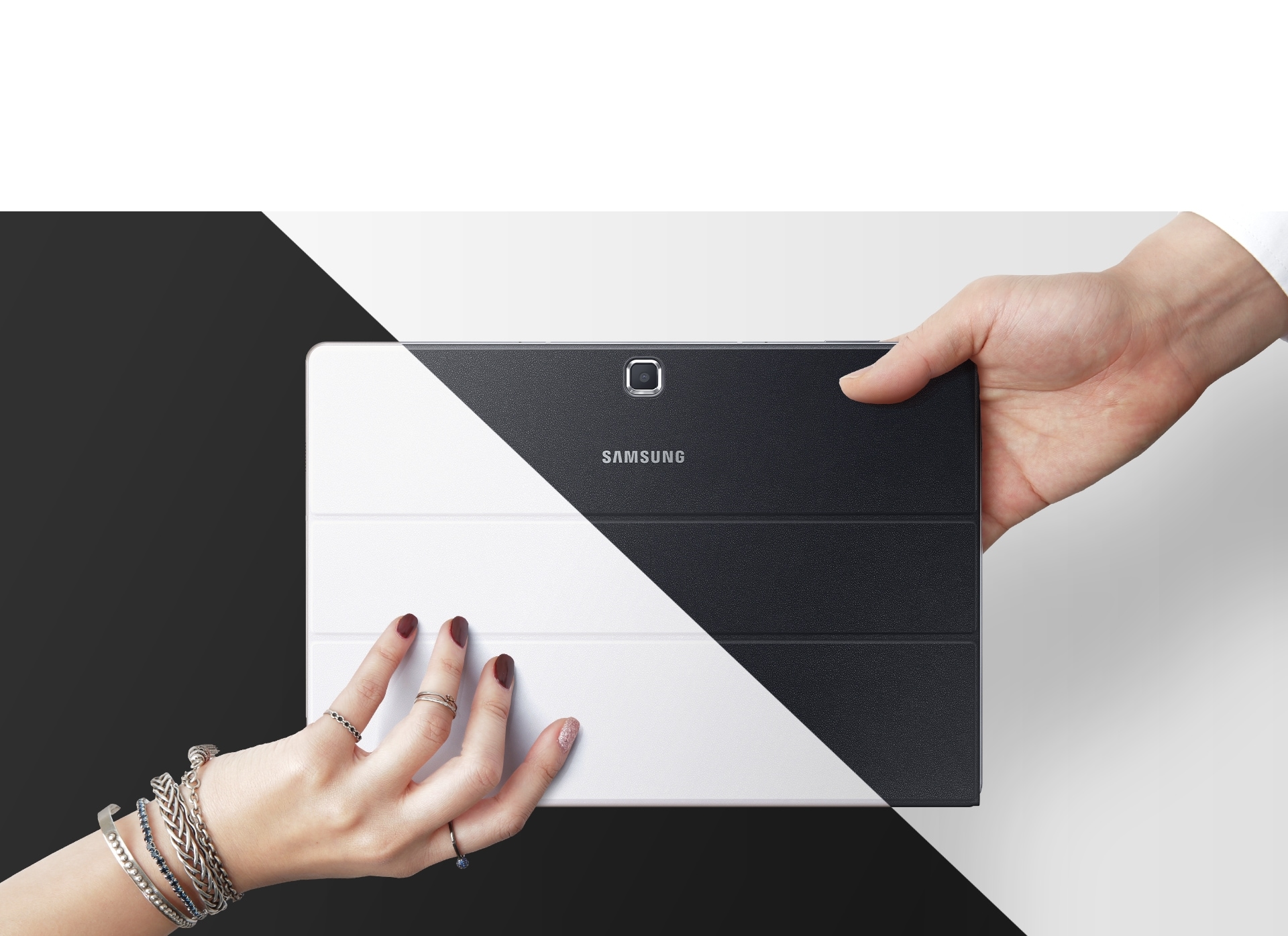 Galaxy TabPro S white held by a woman’s hand, black by a man’s hand