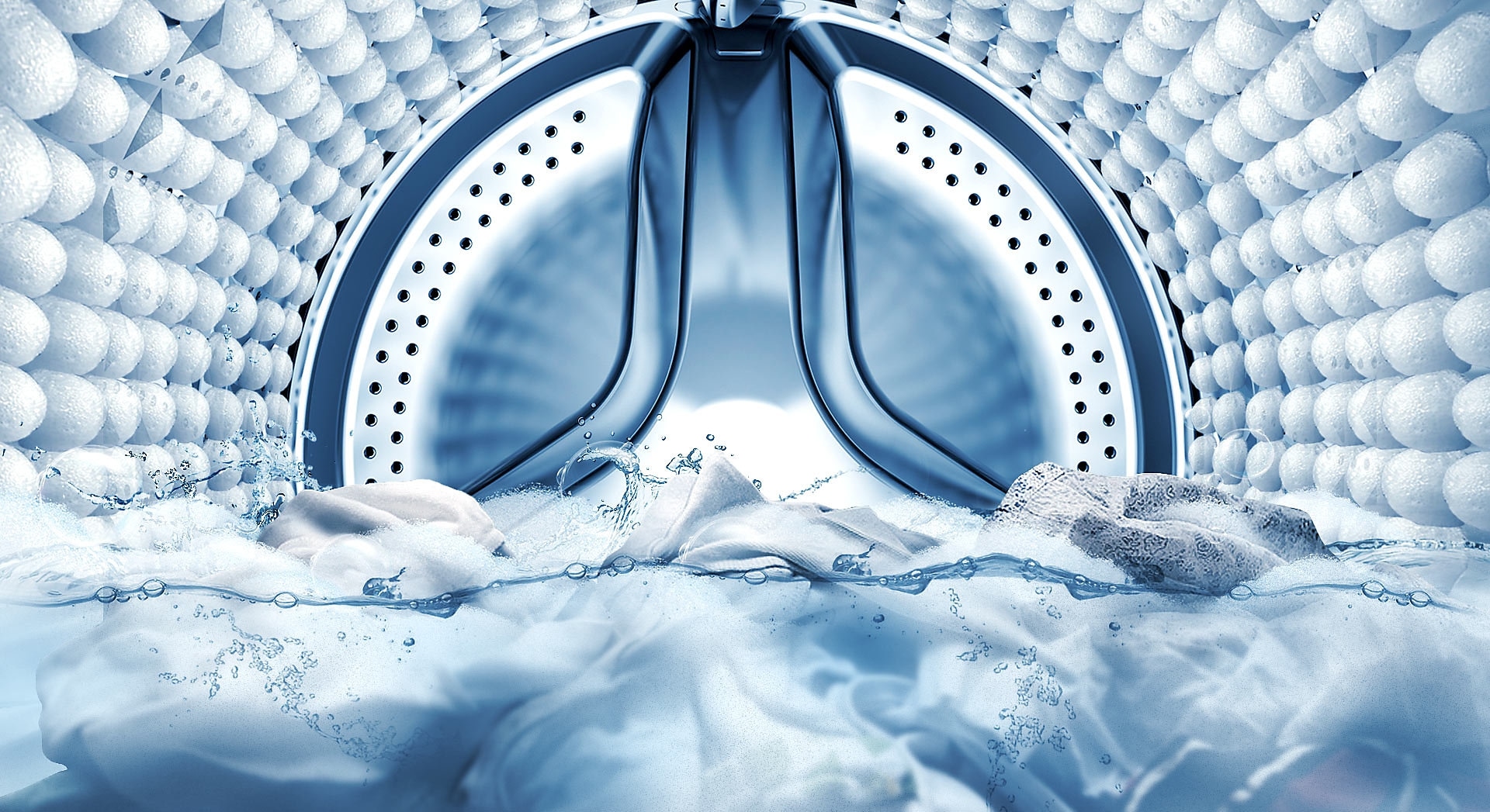 Immagine che mostra l'interno del cestello di una lavatrice, con la funzione Bubble Soak che rimuove le macchie dagli abiti.