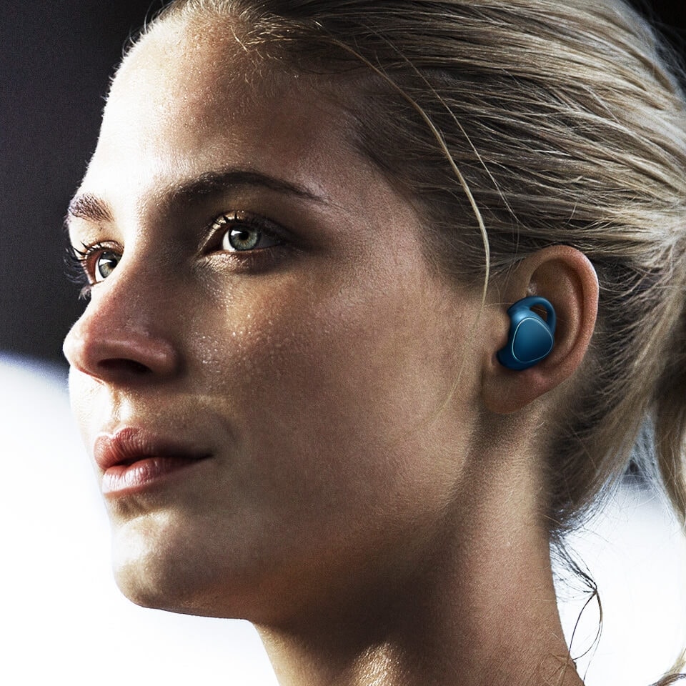 Woman working out with Gear IconX in her ears