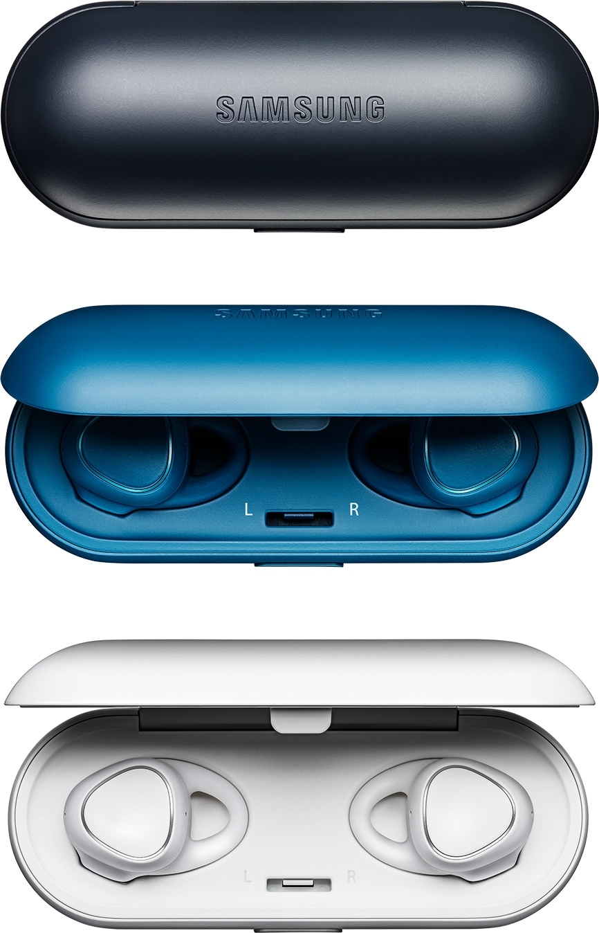 Gear IconX case that doubles as a charger in black along with a Gear IconX case that’s half open and with a pair of blue Gear IconX inside and a white Gear IconX case that’s fully open to reveal a pair of white Gear IconX inside the case that doubles as charger