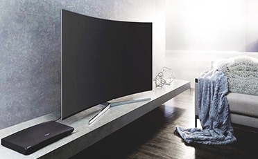 see large image of left perspective image of TV in a bedroom.