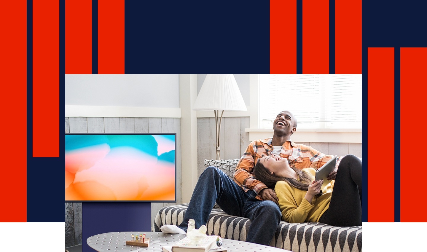 A man and woman lounge and laugh on a couch together as café music on The Sero plays in the background.
