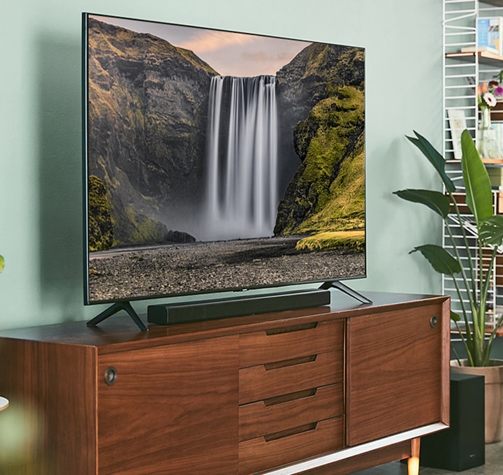 The all-in-one S60T Soundbar designed by Kvadrat is seen placed on a minimal style table, showing how it is designed to be part of the home. The all-in-one S60T Soundbar designed by Kvadrat is seen placed on a minimal style table, showing how it is designed to be part of the home.