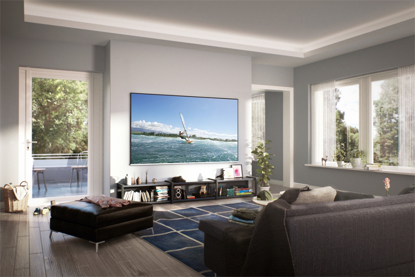 Wide view of cozy living room with daylight from out of the window. A Super Big TV is hung on the wall. On the screen, a man is enjoying surfing.