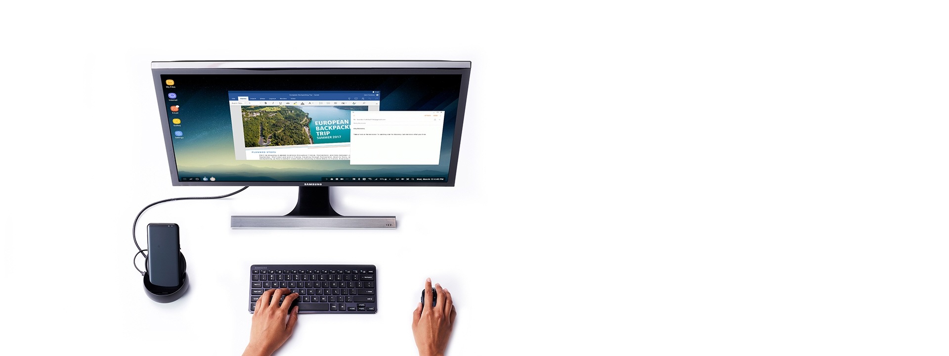 Image montrant un paysage sur un écran d’ordinateur et un Galaxy S8 connecté à une station Samsung DeX.