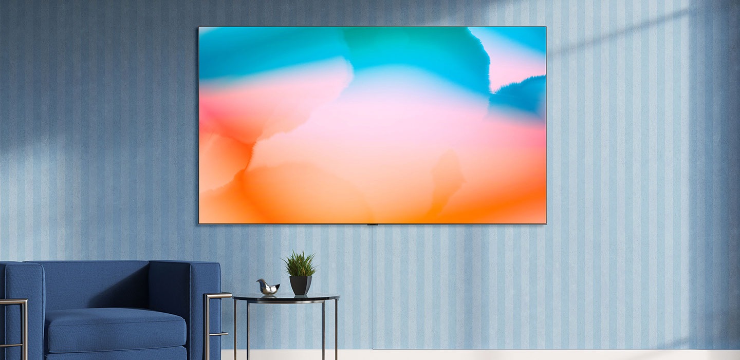 Samsung QLED tv in a room with blue striped wall on the background