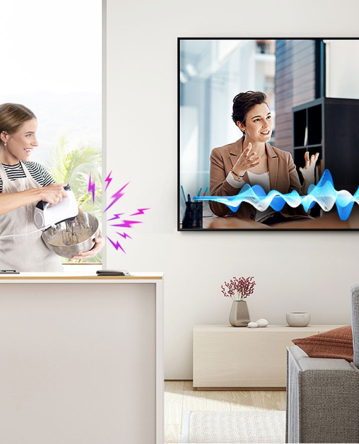 A lady preparing blend mixture for baking looking at tv and using voice app