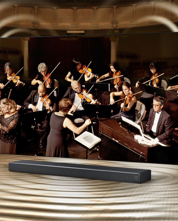 Picture showing a Samsung sounder and a group of musician performing in hall