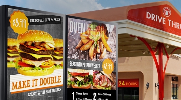 A Samsung outdoor signage displaying menu offerings at the entrance of drive thru