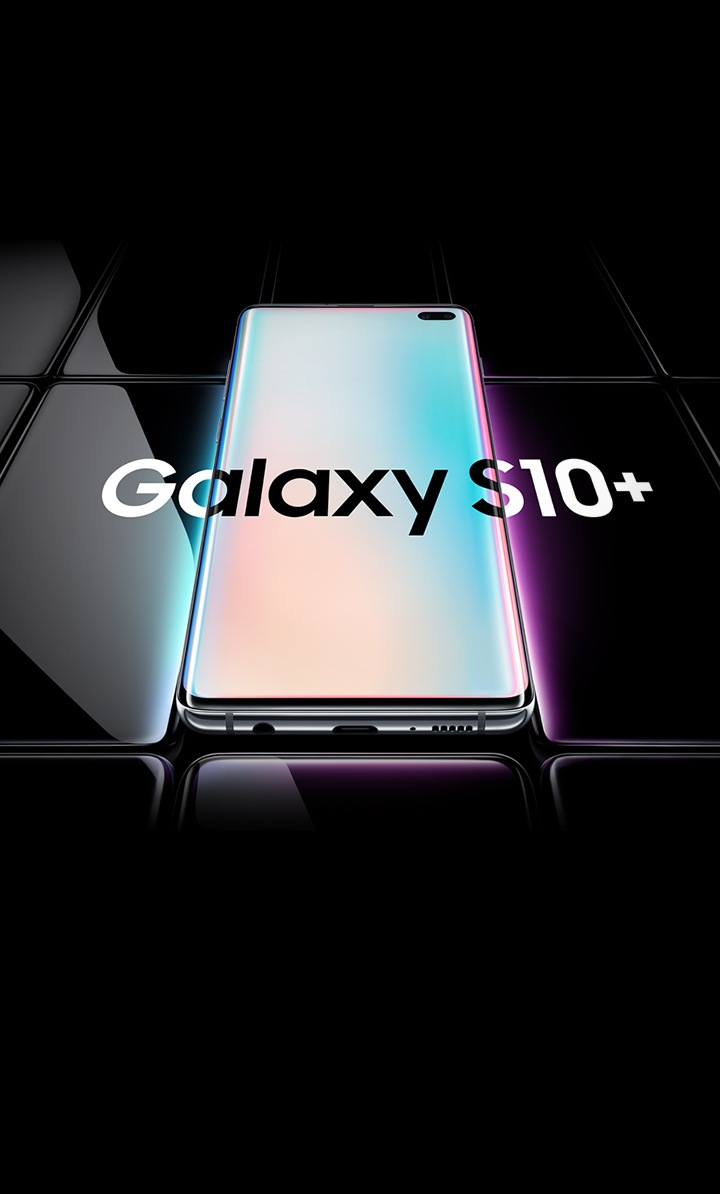 Several Galaxy S10 phones all laid flat and seen at an angle from the bottom. All are black except the one in the middle, which is shown with a prismatic white gradient onscreen with Galaxy S10 overlaid on top of it and the two phones on either side.