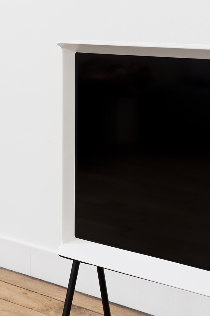 close up white serif tv's bottom part