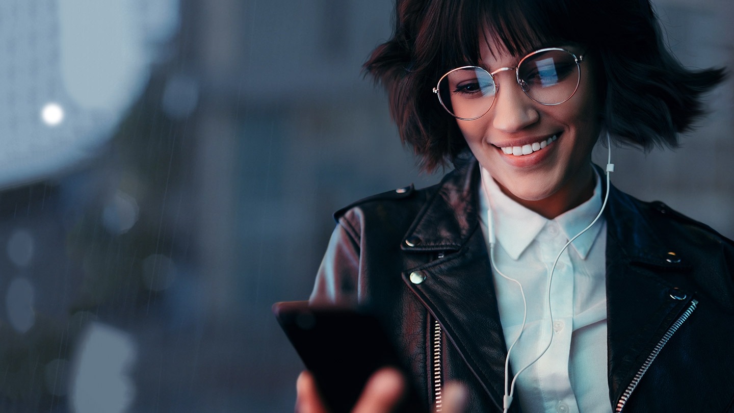 Woman listening to music on Android