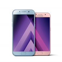 galaxy smartphones presented in front of a night city