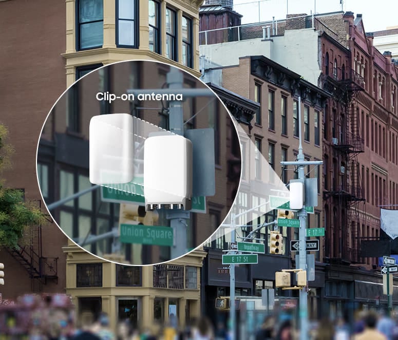 An image of a 4T4R CBRS radio installed on a pole in a city.