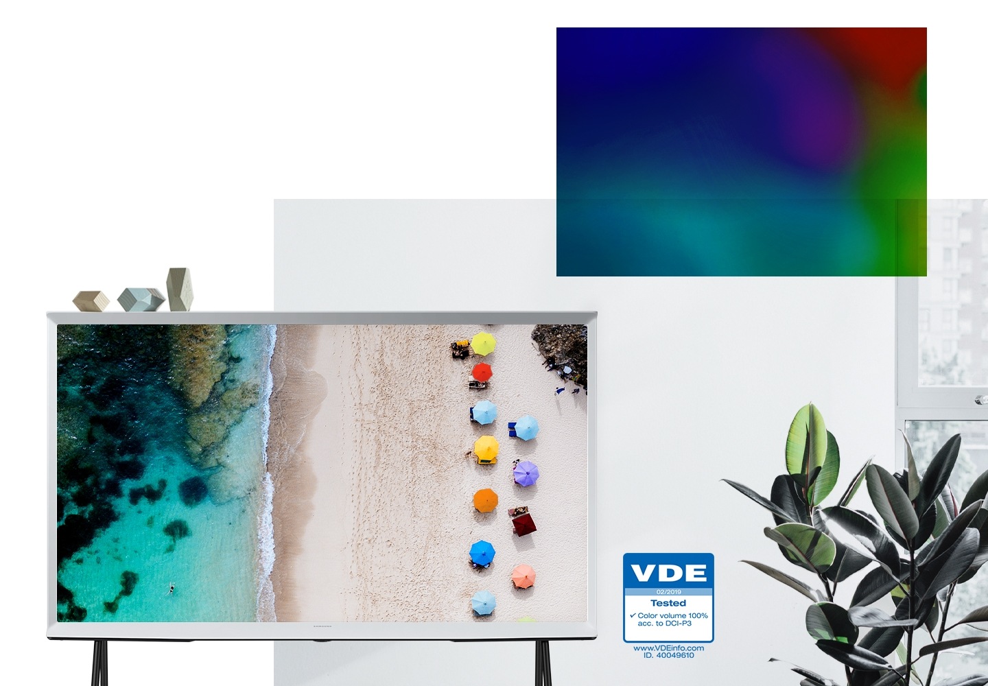White The Serif with vivid colours of a sandy beach and clear water on-screen, popping out of the wall to show colour volume brings the screen to life. A VDE logo verifies QLED colour volume has been tested and certified.