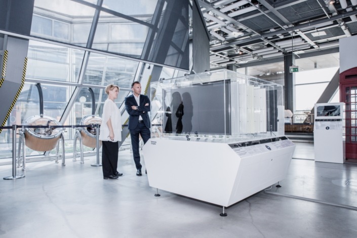Visitors watching a SUHD TV set disassembled into individual parts