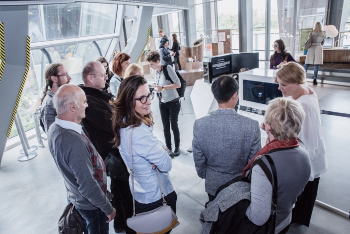 Visitors watching a SUHD TV set disassembled into individual parts_2