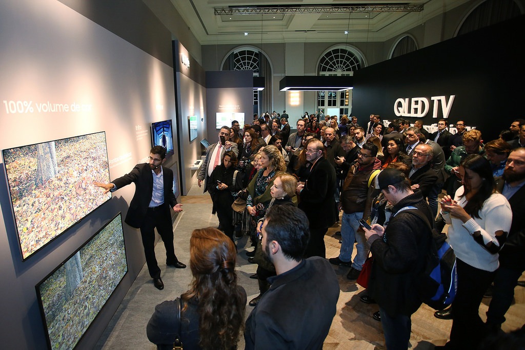 Attendees at a QLED TV launch event in June 2017, in Brazil, take in the display’s immersive visuals.