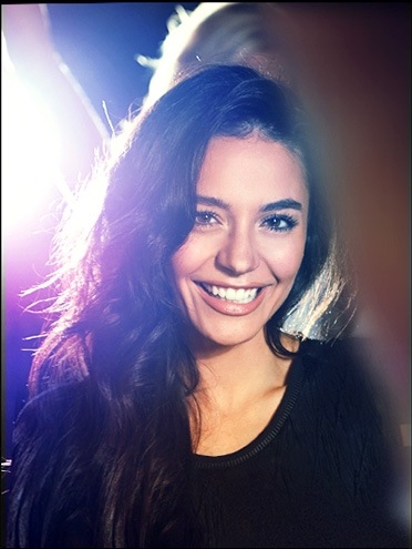 Image of woman about to take selfie with the Galaxy S8 camera shown on the Galaxy S8 camera app