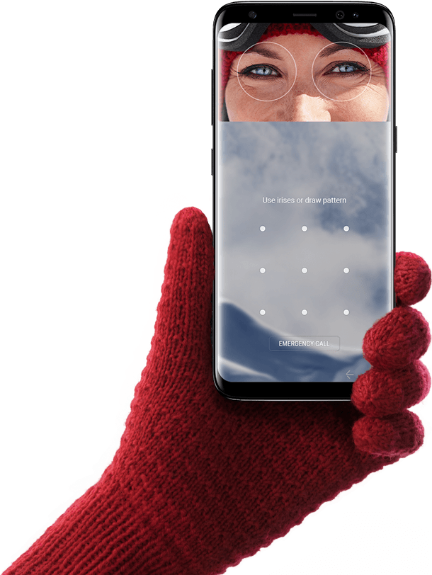 Hand holding Galaxy S8 with person’s eyes aligned with circles on the screen for iris scanning