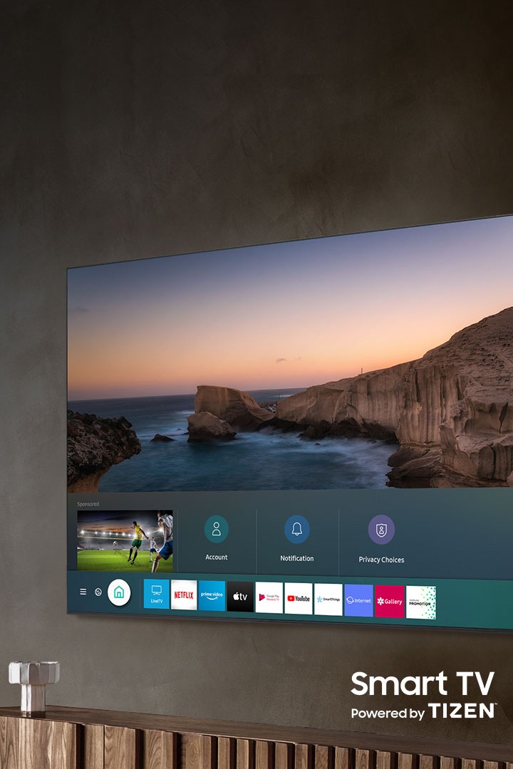 2020 Samsung QLED TV which is hanging on the wall has Smart hub with Smart TV powered by TIZEN.