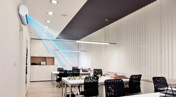 A wall mount air conditioner operating in an office