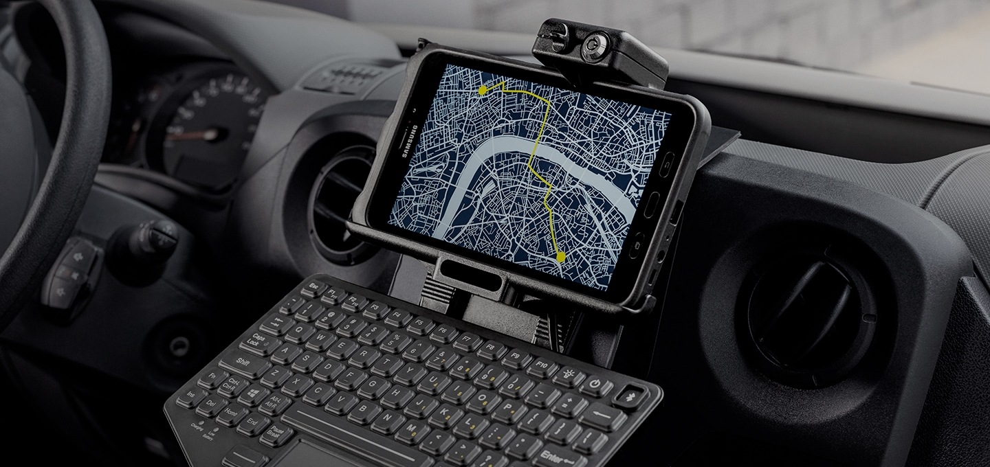 A Samsung tablet mounted on a truck dashboard with a Sat-Nav function on