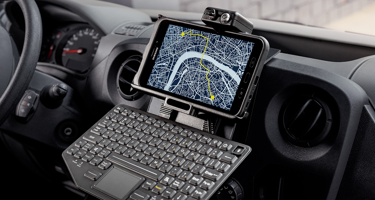 A Samsung tablet mounted on a truck dashboard with a Sat-Nav function on
