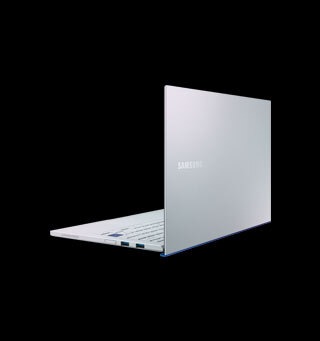 A white Samsung Galaxy Book Ion tablet laptop stood open with back of the laptop facing forwards in front of a black background A white Samsung Galaxy Book Ion tablet laptop stood open with back of the laptop facing forwards in front of a black background