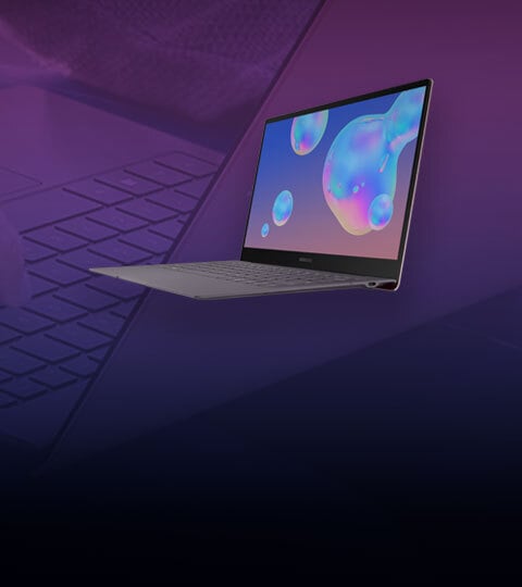 A dark grey Samsung Galaxy Book S laptop stand open with screen facing forwards in front of a purple background A dark grey Samsung Galaxy Book S laptop stand open with screen facing forwards in front of a purple background