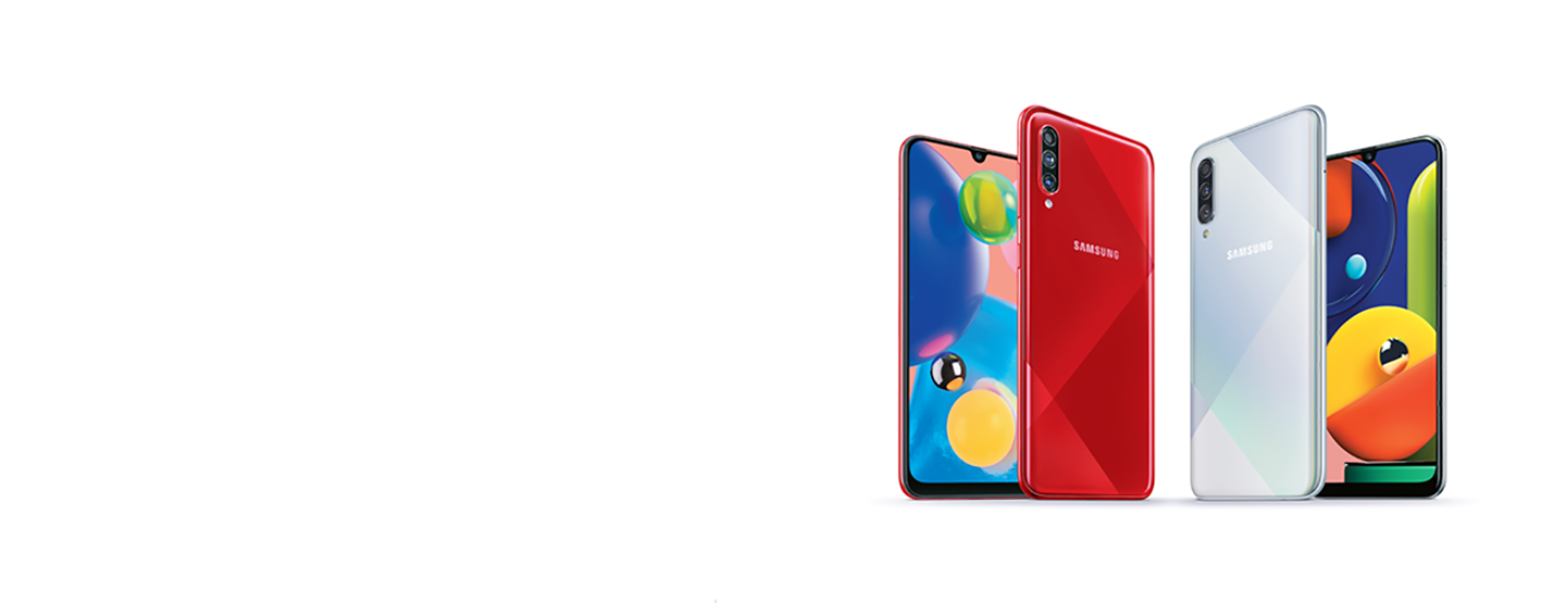 Four Galaxy A70 phones are shown side-by-side. The two outside show the front screen partially, while the two inside phones show the full back, one red and one silver.