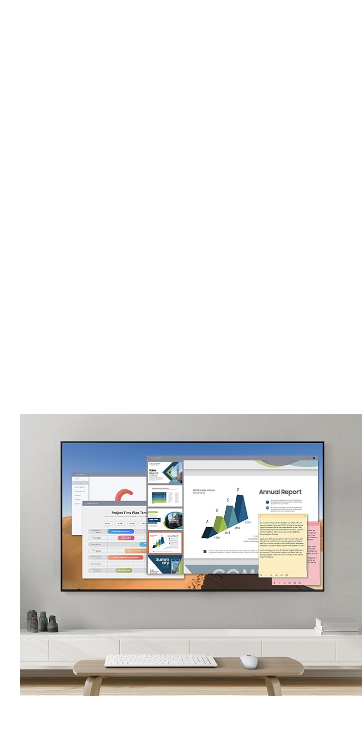 2020 Samsung QLED TV has a remote access that lets you mirror your computer's display on tv screen. TV onscreen is showing your office works such as annual report and project time plan.