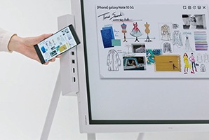 At the side of the Flip 2 screen, there's a tray attached that provide various fuctions. Of them, the image shows "NFC tagging" feature and someone attaches his mobile phone beside the tray to connect his mobile phone to Flip 2 screen.