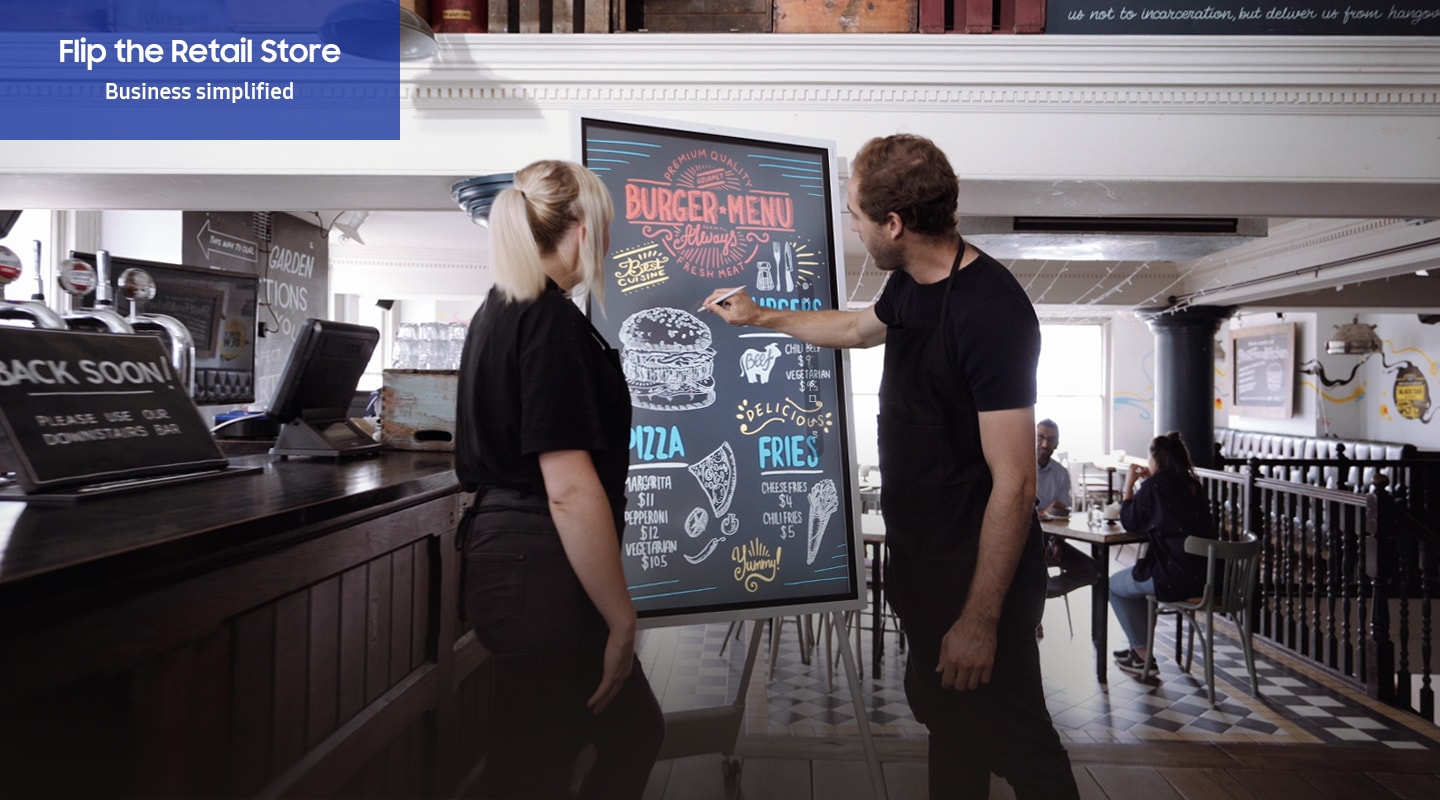 In the retail store, Samsung Flip 2 can be a great tool for customer communication. Clerks are completing the menu board with a Flip 2 in the restaurant and a customer orders a food by seeing Flip 2 and gets her food.