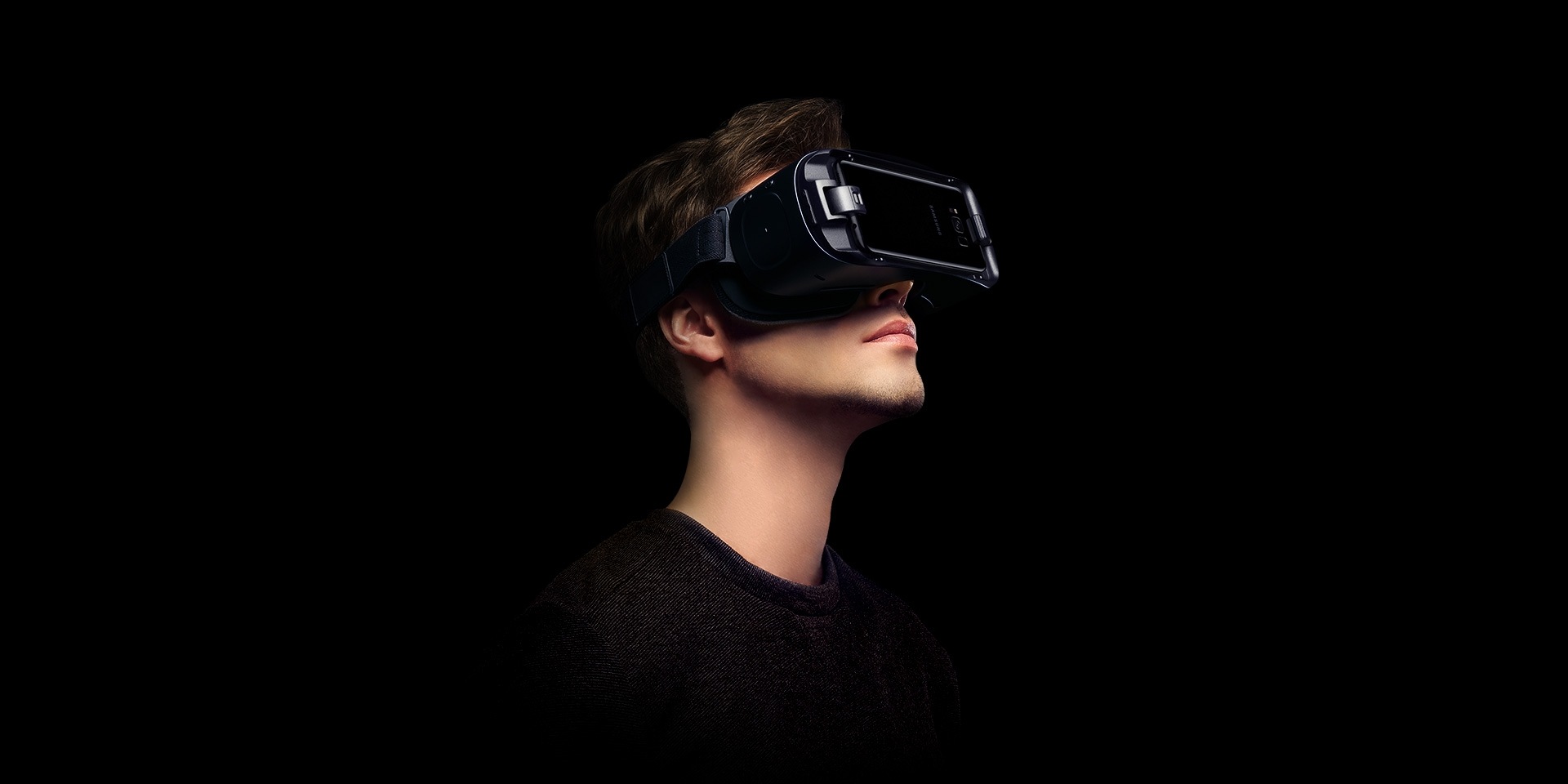 Person wearing Gear VR with the Galaxy S8 and looking up