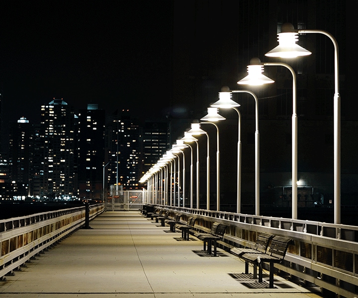 Samsung LEDs an illuminated streetwith benches lit by a row of street lamps