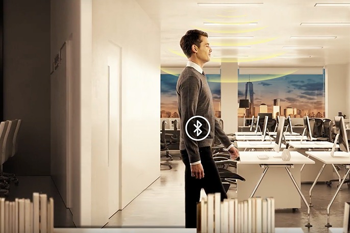 Samsung LEDs a man walking at the smart office that detects human motion through bluetooth