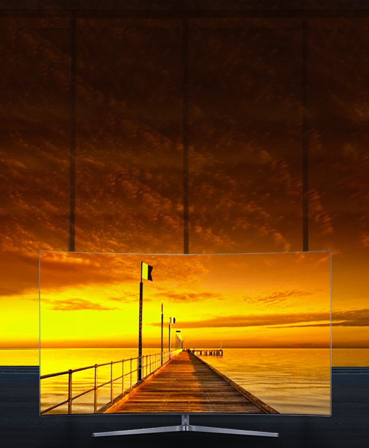 Samsung LEDs the image of beautiful sunset at the beach inside a TV perfectly connected to the real one outside due to bezel-less design