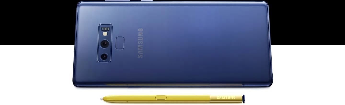 Ocean Blue Galaxy Note9 seen from the rear, sitting on the right side, with yellow S Pen laying in front