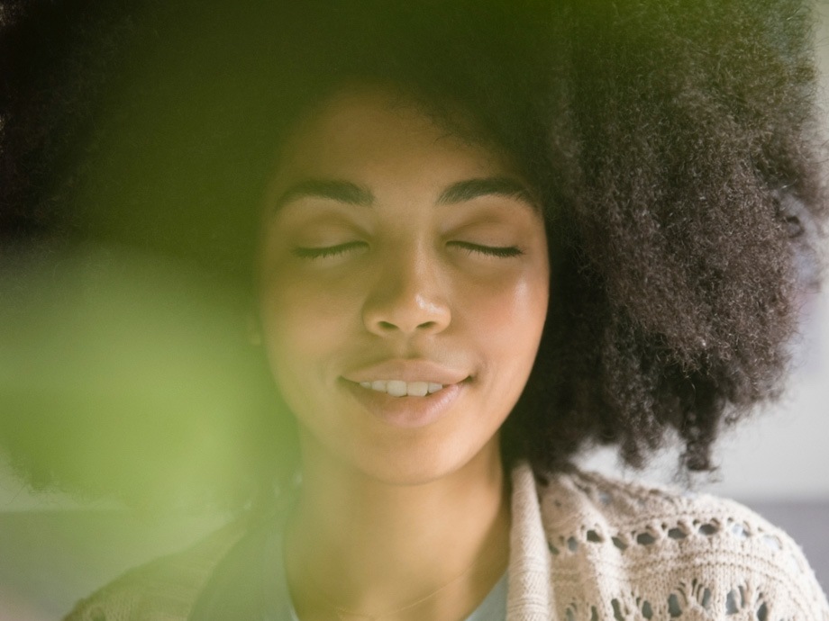 A woman practicing mindfulness meditation