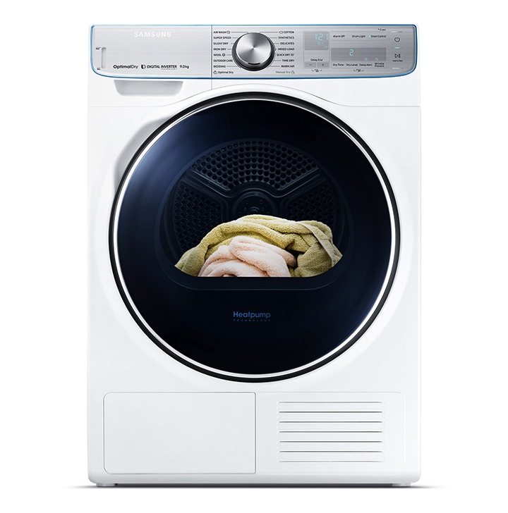 Cropped image of white Samsung heat pump tumble dryer with clothes inside. White Samsung tumble dryer.