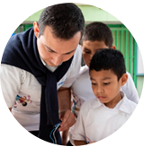 A man and two boys are doing a science experiment.