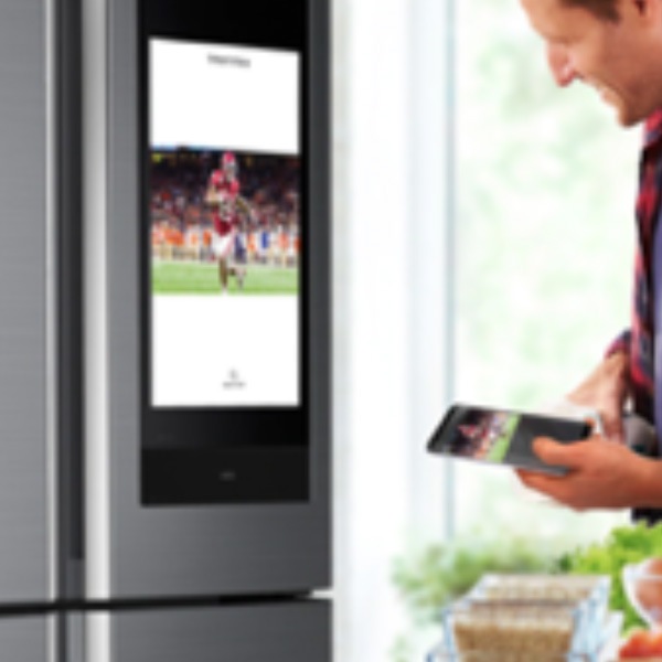 Guy controlling the screen on his refrigerator from his phone