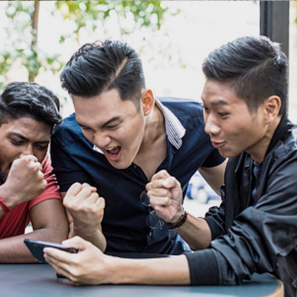 Three guys cheering over