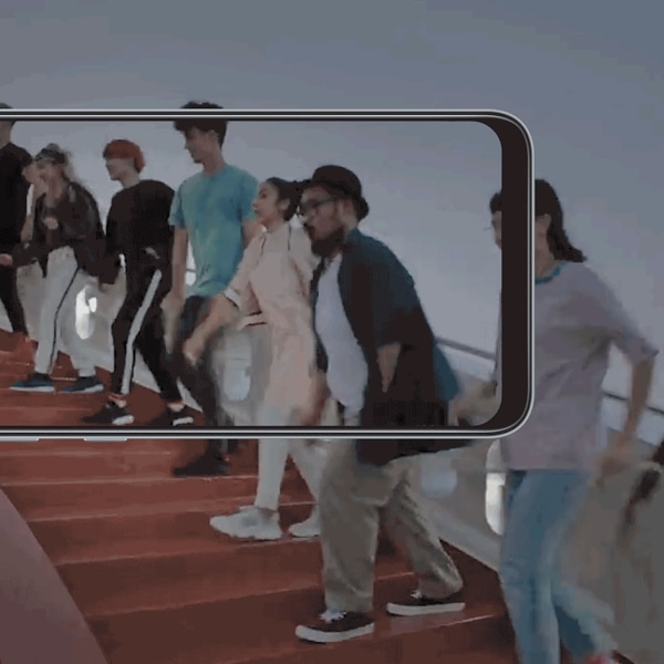 Galaxy A film scene (GIF) in the backdrop of a Samsung phone