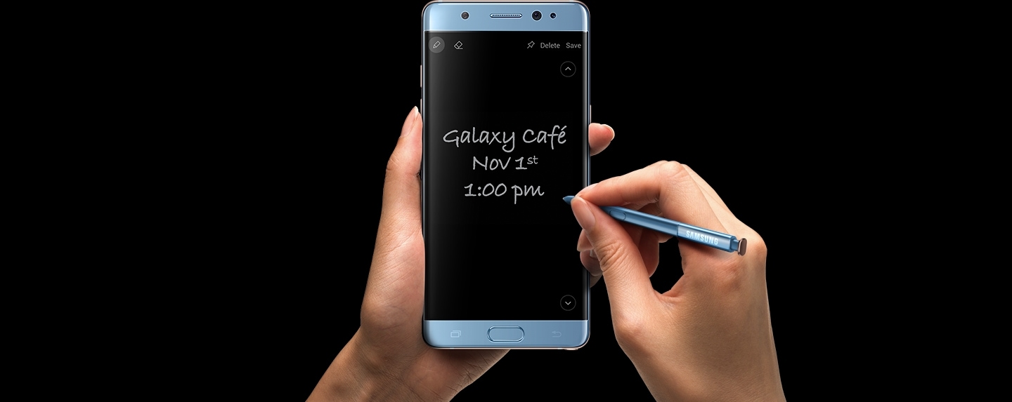 Left Hand clutching the Galaxy Note FE Black Onyx with S Pen writing Screen Off Memo